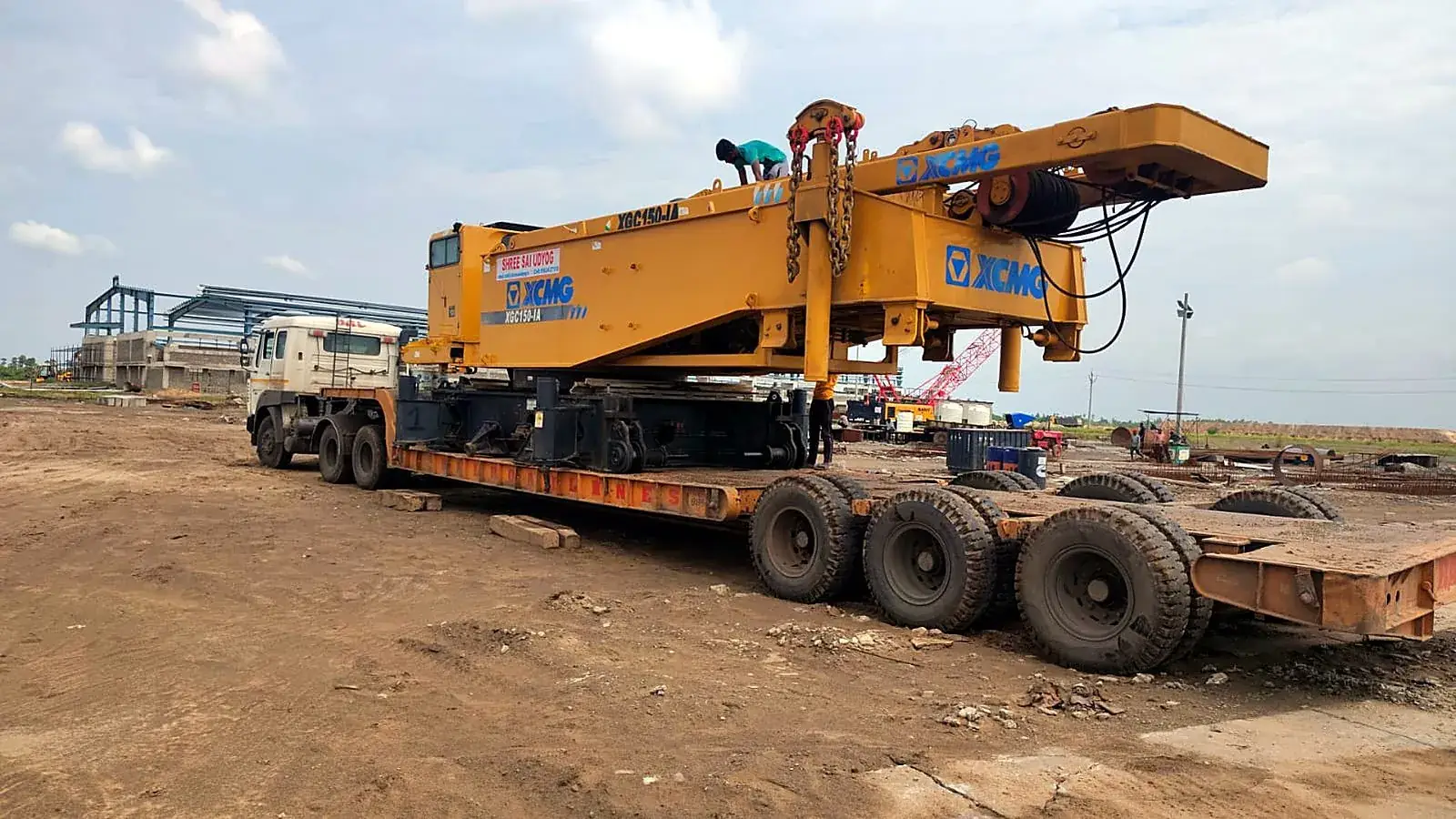 Heavy crane equipment on a low-bed trailer, side view