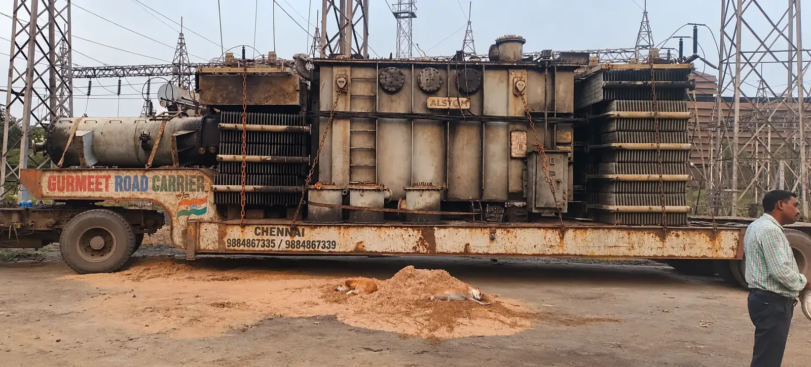 Large transformer on a multi-axle trailer at a substation yard